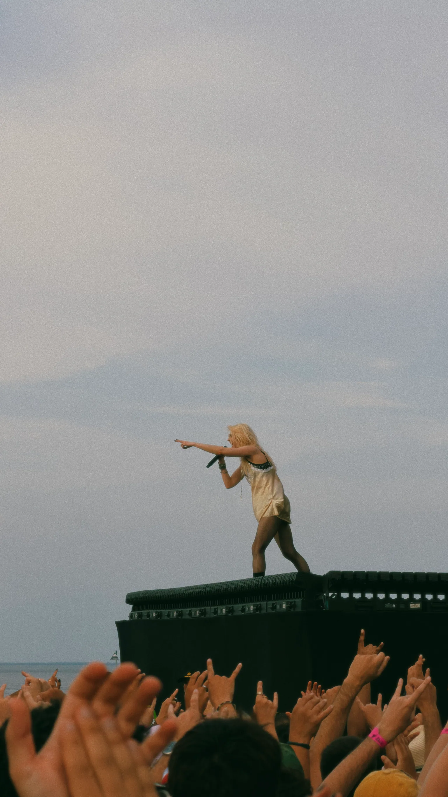 Taylor Momsen pointing towards the audience from the front of the Rock in Rio Lisboa stage